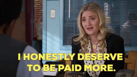 A blond white woman in professional clothing says "I honestly deserve to be paid more."