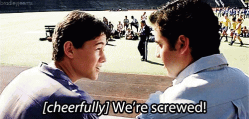 An extremely young Joseph Gordon-Levitt (Ten Things I Hate About You) smiles and says "We're screwed!" as he sits with his friend (David Krumholtz) on high school bleachers.