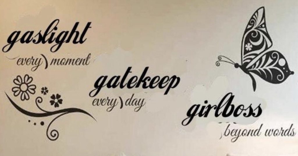 A wall stencil of butterflies with the message: gaslight every moment, gatekeep every day, girlboss beyond words.